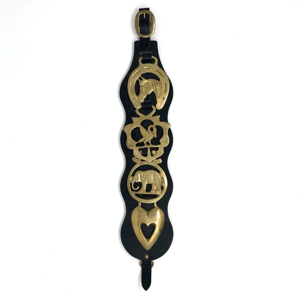 4 vintage horse brass medallions on black strap